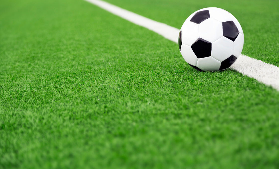 Close-up of baseball turf fibers showing infill system and seam detail