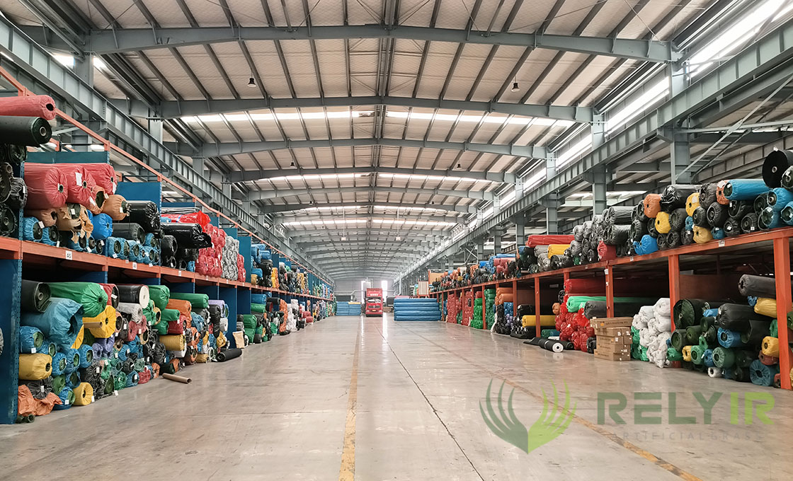 Relyir warehouse stocked with artificial grass rolls ready for export