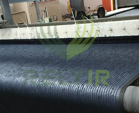 Coating latex onto tufted artificial grass backing
