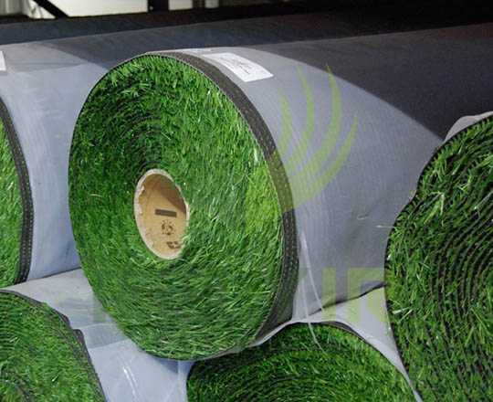 Rolling up finished artificial grass for shipment