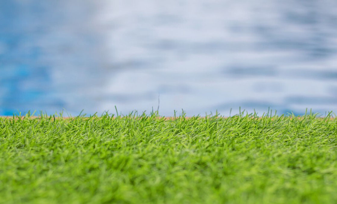 Artificial grass around residential swimming pool