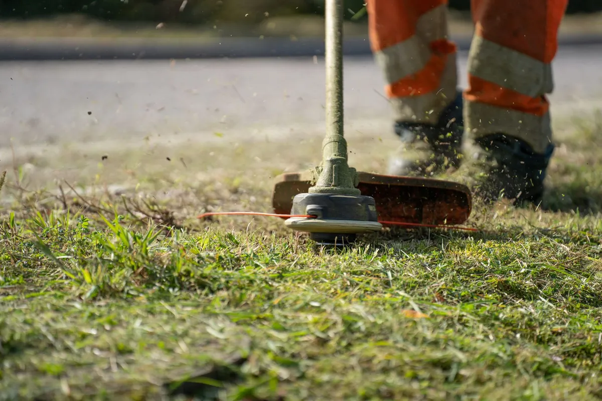 Artificial turf backing and drainage holes shown before a lawn installation