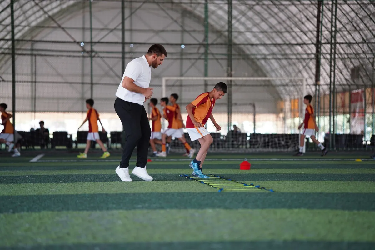 Young player in a soccer training session on indoor turf