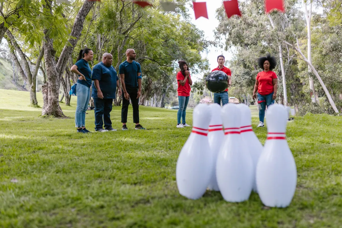 Players on an outdoor bocce-style court
