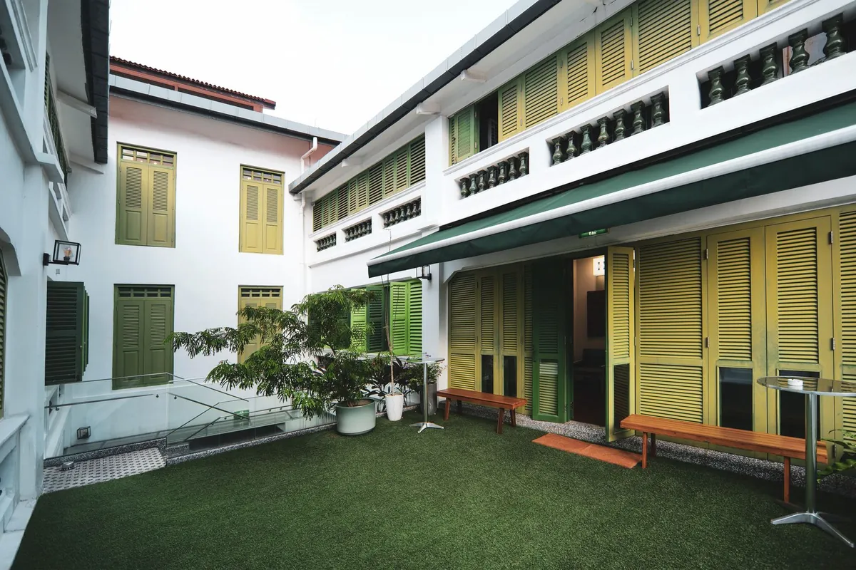 Artificial grass laid on the floor of a small outdoor courtyard