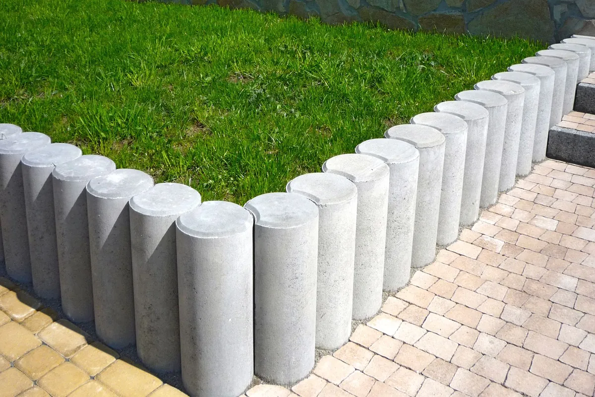A hard edging strip defining the boundary of a grass surface