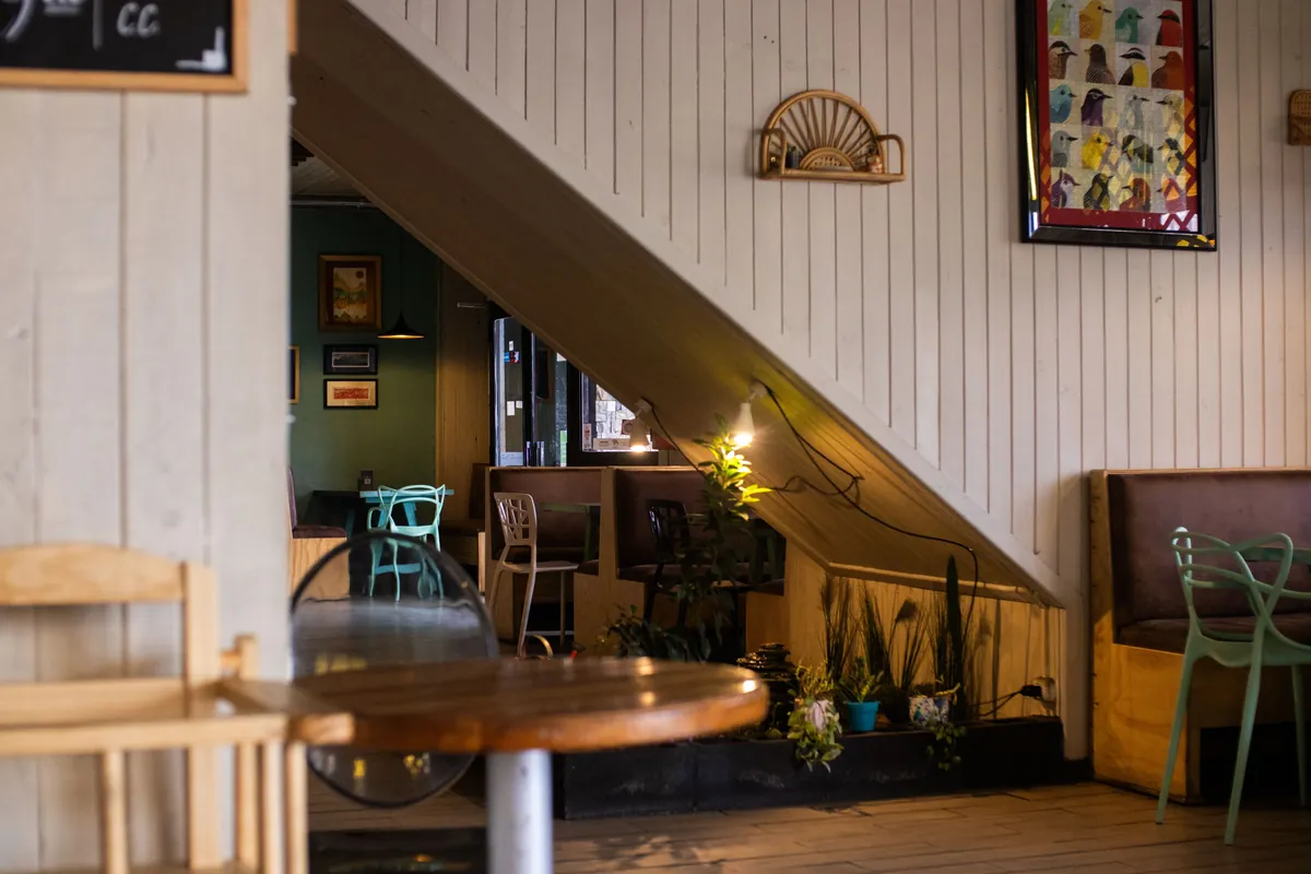 Inviting cafe interior with wooden decor and ambient light