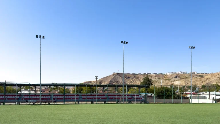 Green artificial turf field under open sky