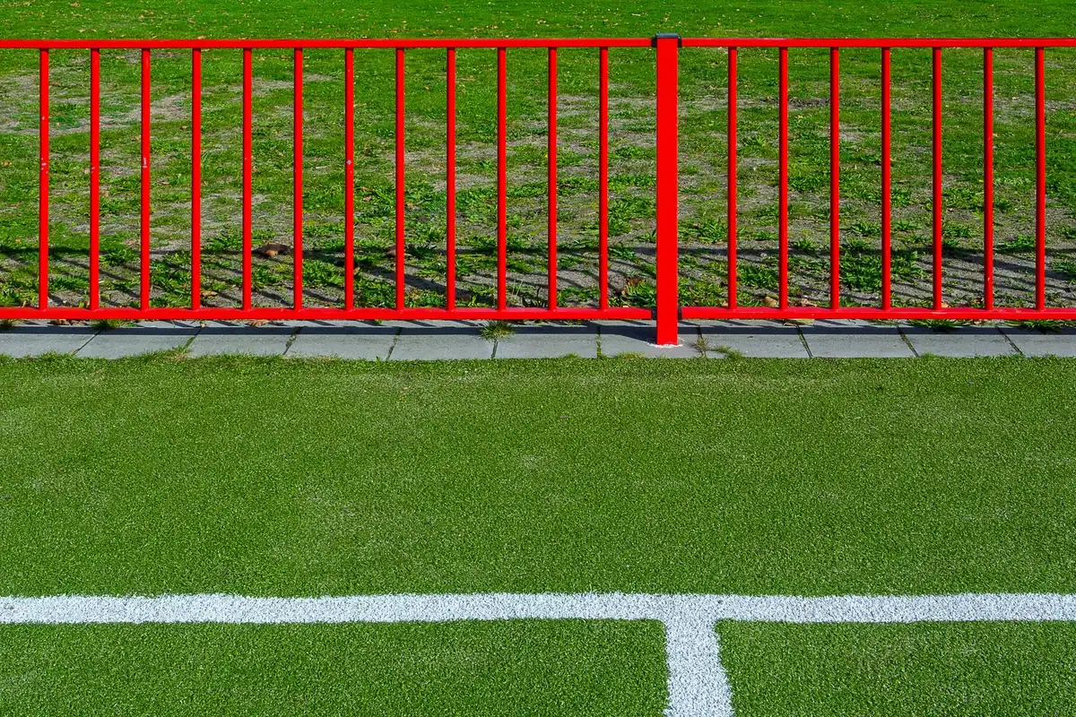 Artificial turf field with white line markings across the surface