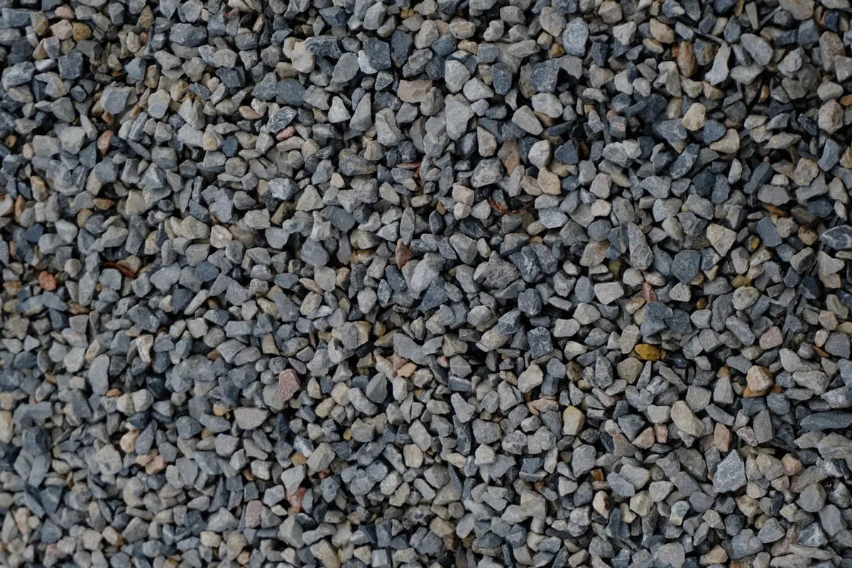 Compacted grey aggregate stones forming a level surface