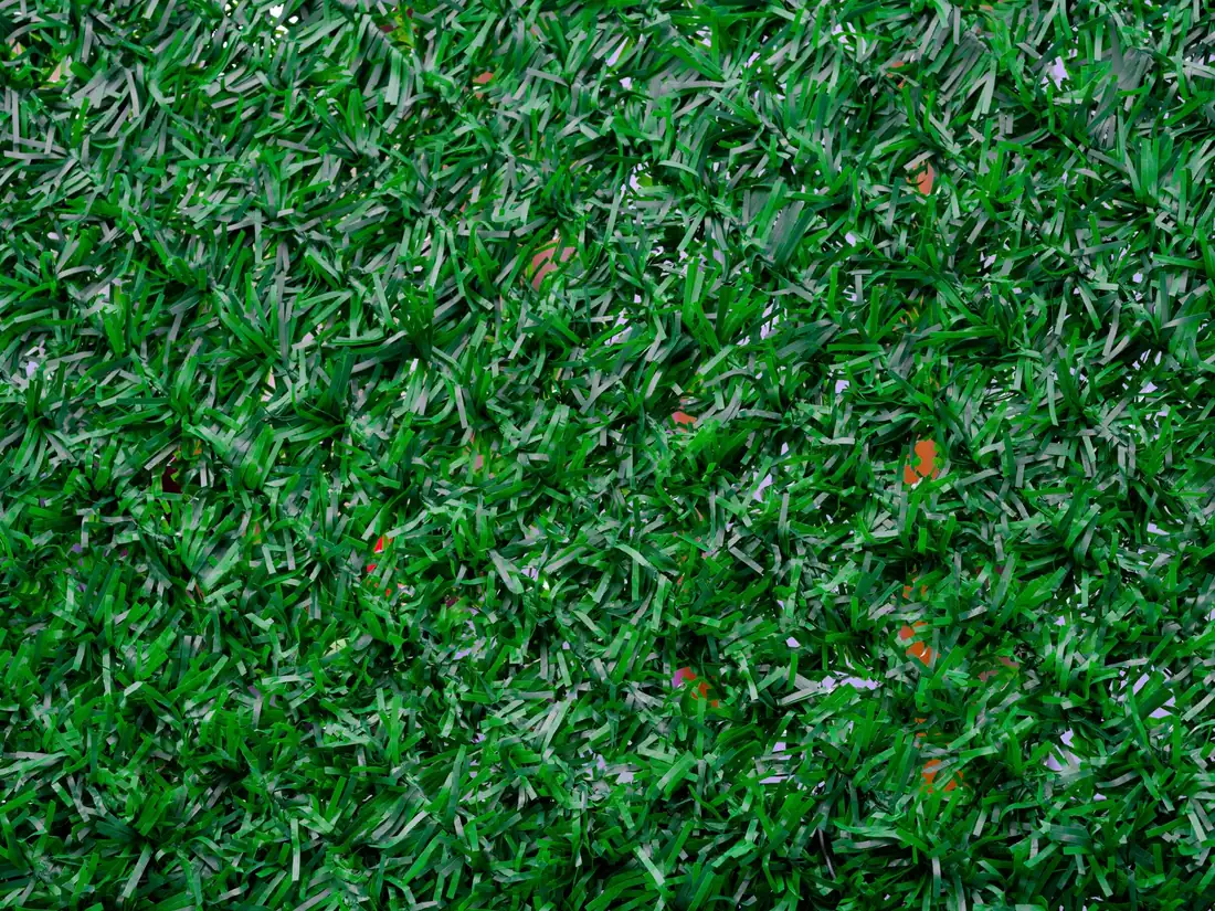 Synthetic green grass blades in vibrant close-up detail