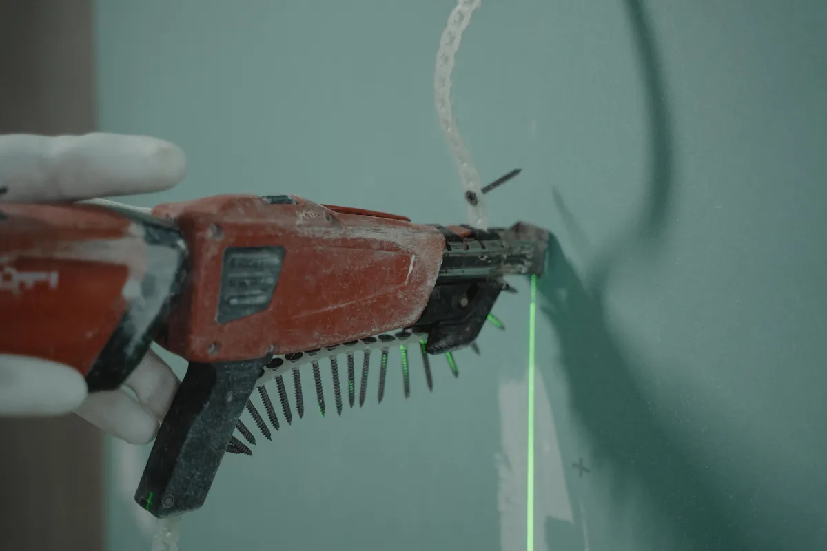 Close-up of a power drill in use for mounting