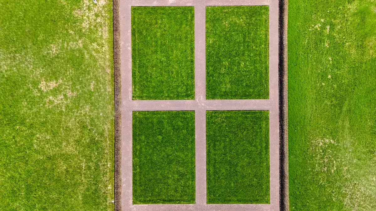 Wide green artificial turf surface seen from above