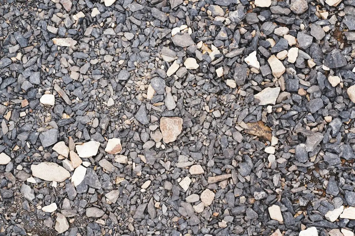 Compacted gravel surface prepared for a field