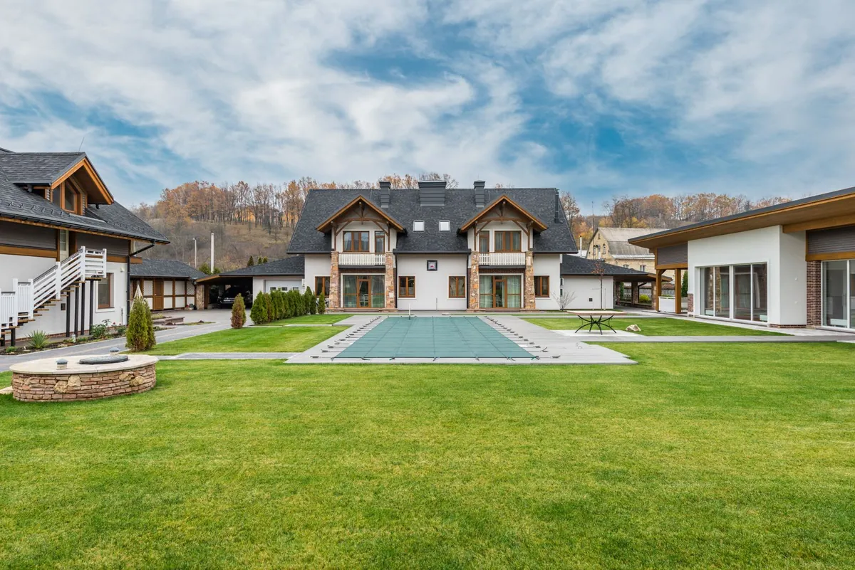 Green artificial grass lawn beside a patio in summer