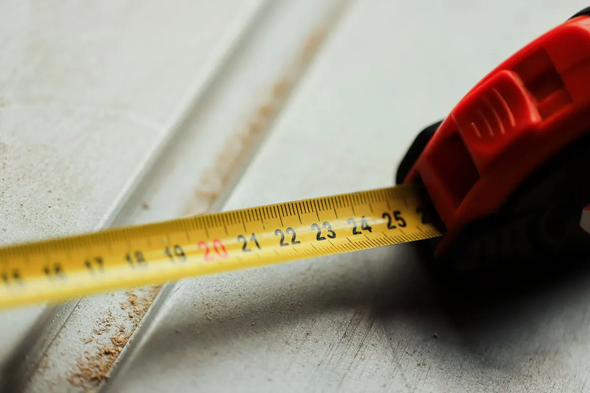 A tape measure laid on a hard surface during a site measure