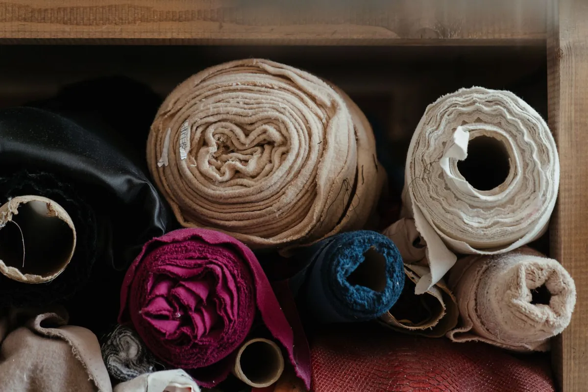 Fabric rolls neatly arranged in a workshop setting