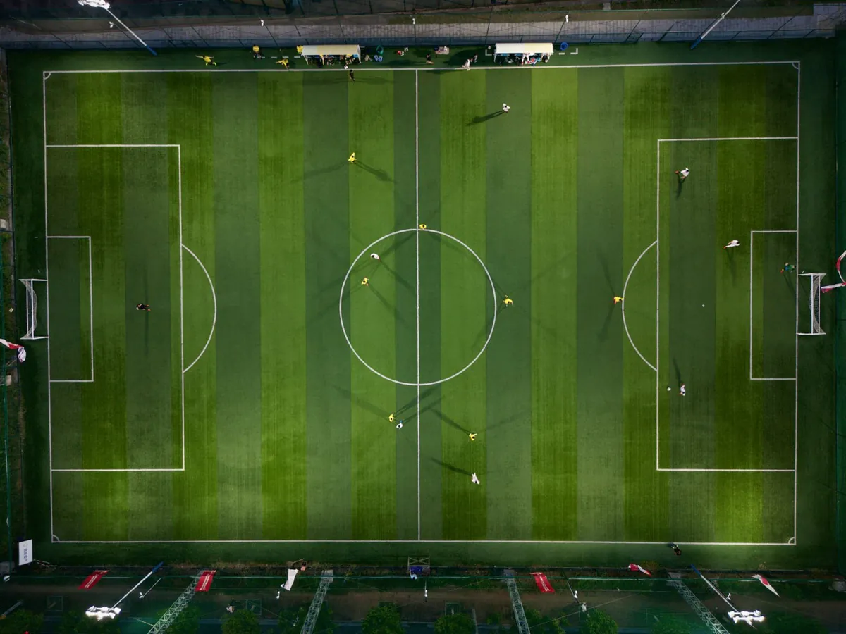 empty soccer pitch at dusk showing scale and turf uniformity