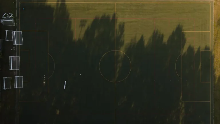Green artificial turf field under open sky